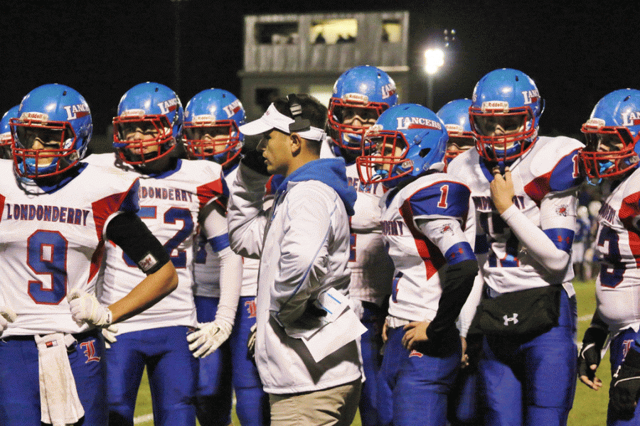 Coach Lauzon gathers his team together during the game against Winnacunnet this past Friday.