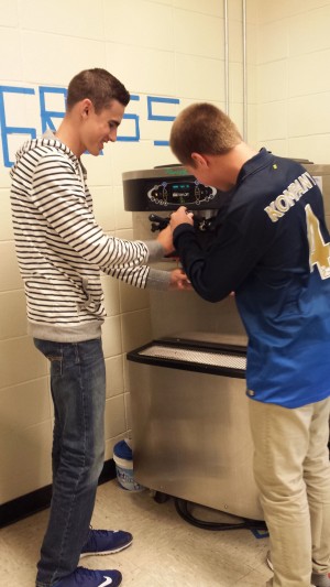 Juniors Ian Candela and Jackson Lyscars test out the new frozen yogurt machine during E period lunch.