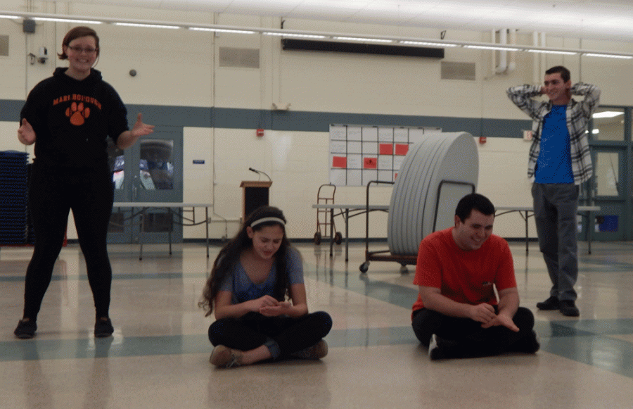 During the game “awkward encounter,” two actors, Abby Dalmer bottom left and Daniel Cain bottom right, pretend to be two people encountering each other for the first time. At the same time two other actors, Danika Dixon left and Evan Plevinsky right, pretend to be person the people’s thoughts during the encounter.