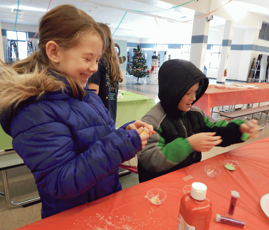 Kids enjoy making crafts at the Winter Holiday Festival.