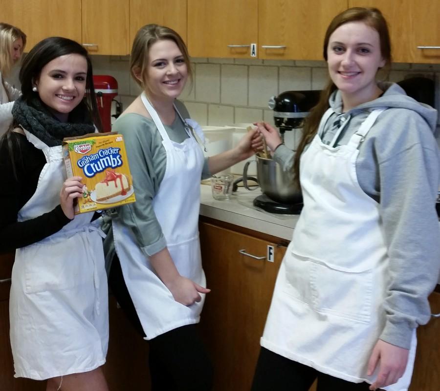 Seniors Shelbi Pincence and Julia Sorrel and junior Hannah Donahue enjoy getting the chance to create new foods during culinary club.