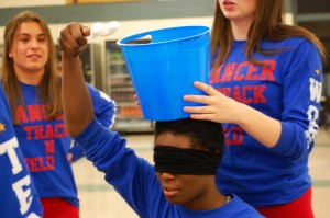 A unique game NHS conducted was called the cotton ball scoop and involved a blindfolded player having to scoop cotton balls up over their head into a bucket.