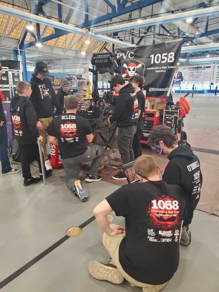 The LHS Robotics Team diagnoses problems with the Black Pearl.