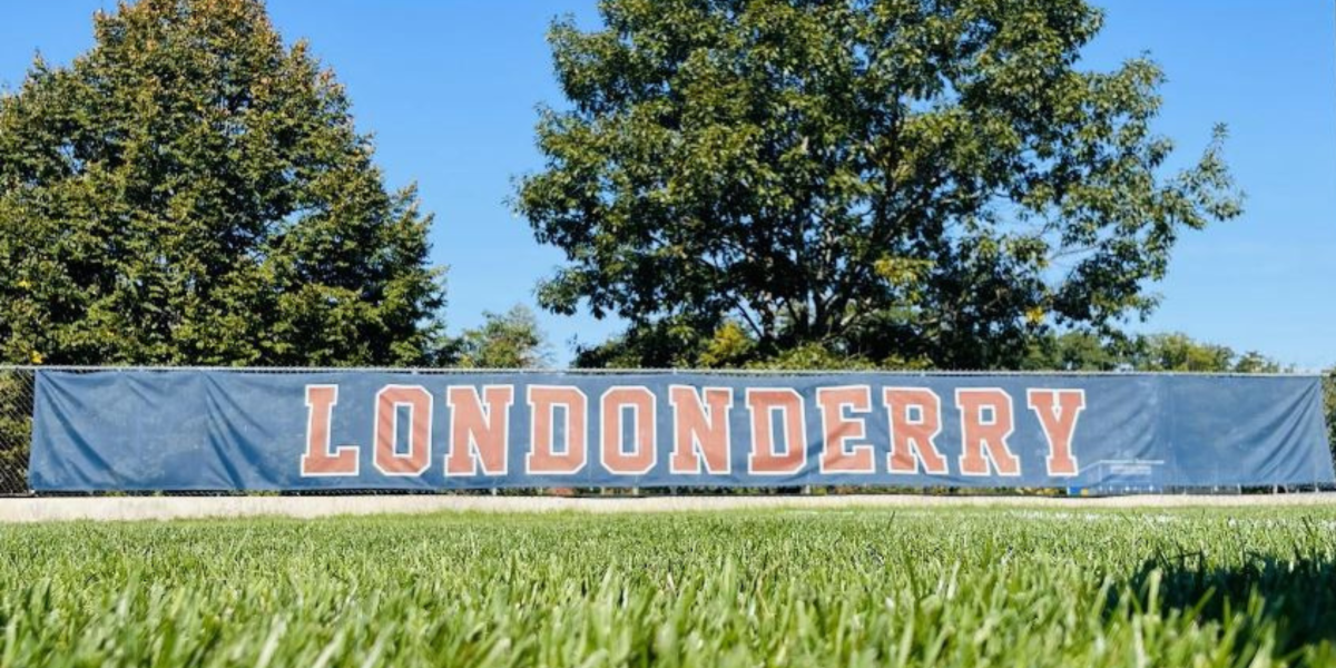 Londonderry banner stands over the grass of campus grounds.