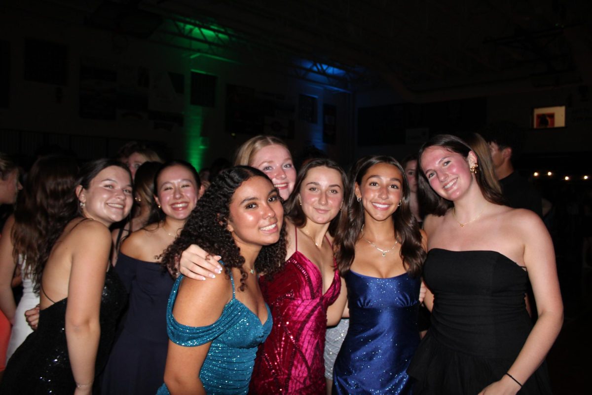 Seniors, Maddie Tufts, Katie Croteau, Lizzie Sosa, Aliviyah Awad, Ava Windisch and Juniors, Leah Kemabll-Cook and Gill Rosen smiling at homecoming.