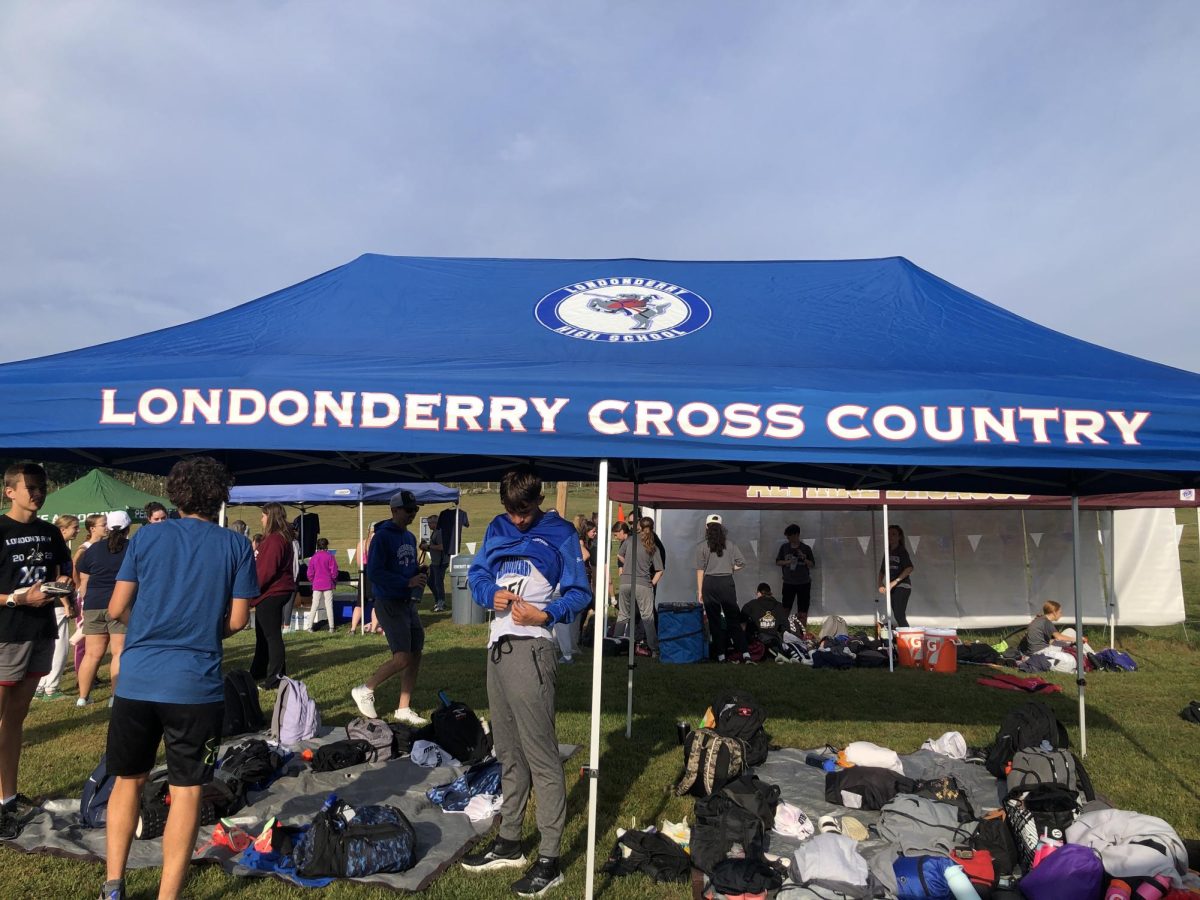 Londonderry Cross Country athletes prepare to race and pin on their racing numbers