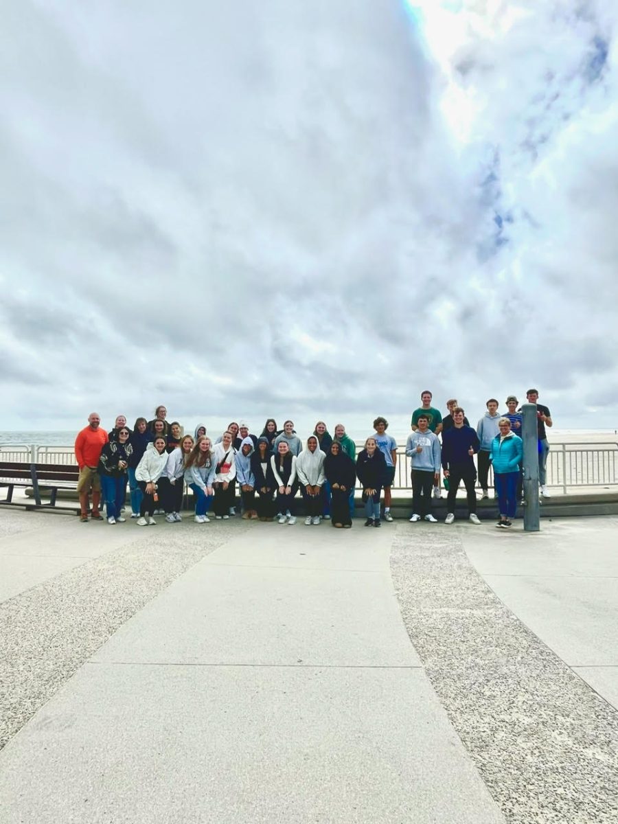 APES students take time out of their day to work together and clean up Hampton Beach. 
Photo used with permission by Daniel Grant