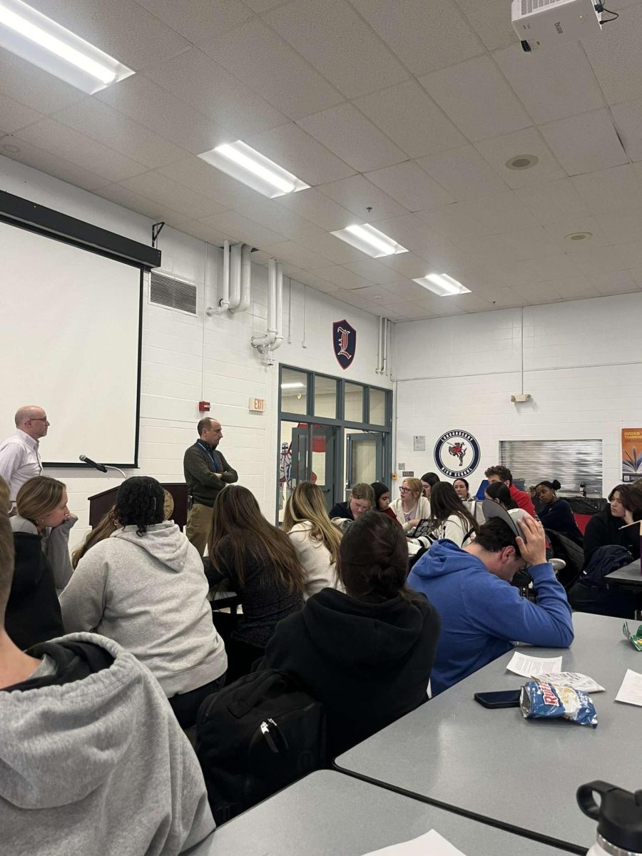 Superintendent Dan Black and Principal Rick Barnes address the Student Council and Class Officers about interesting in upgrading the phone policy. 