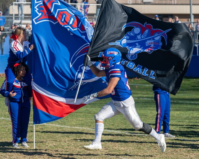 Palma leads the team out before the quarterfinals. (Photo by Charlie Ogden) 
