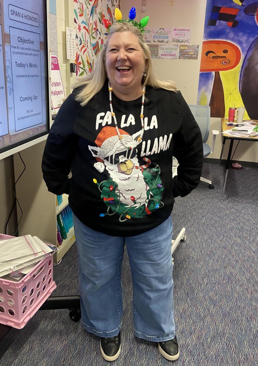  Señora Halpern shines bright for teacher’s spirit day. Her festive outfit lights up the classroom with holiday cheer. 