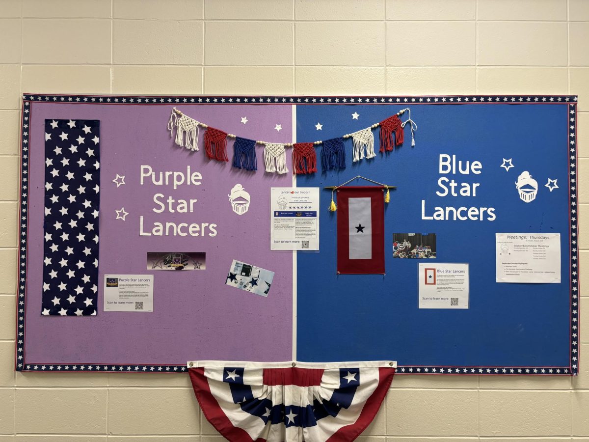 Blue and Purple Star Lancers board outside of Mrs.Juster's room with information on how to get involved. (Photo used with permission by Elizabeth Juster)