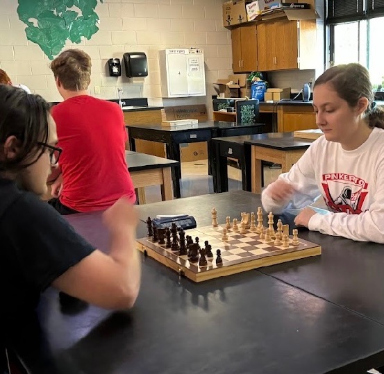 From Pinkerton Academy, senior Neveah Smith joins senior Logan Boulanger for a competitive chess match during Mac Plaque.

Photo used with permission by Sebastian Vollmar.